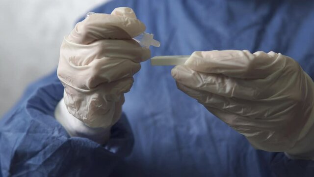 The doctor makes a rapid PCR test for the antigen of the covid-19 virus. Covid-19 pandemic concept.