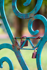 Padlock on the metal fence symbolizes love. - 480929337