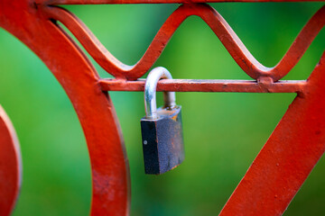 Padlock on the metal fence symbolizes love. - 480929344