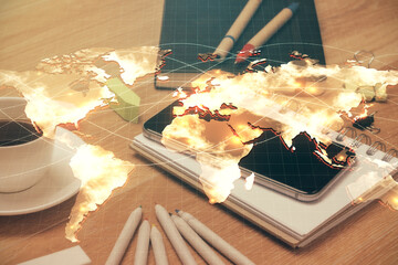 Double exposure of financial theme drawing and cell phone background. Concept of business