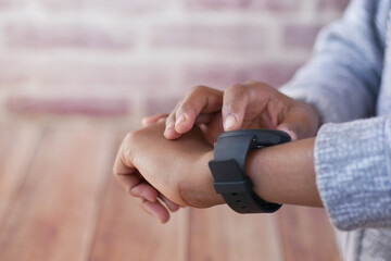  man's hand using smart watch.