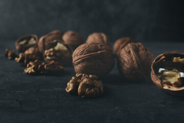 Fresh walnuts with copy space in dark mood shot.