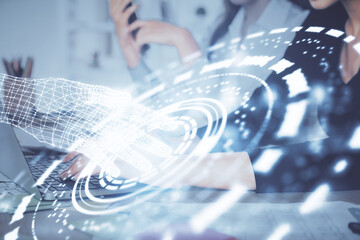 Multi exposure of woman hands working on computer and data theme hologram drawing. Tech concept.