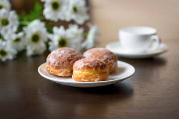 many donuts and cup of tea