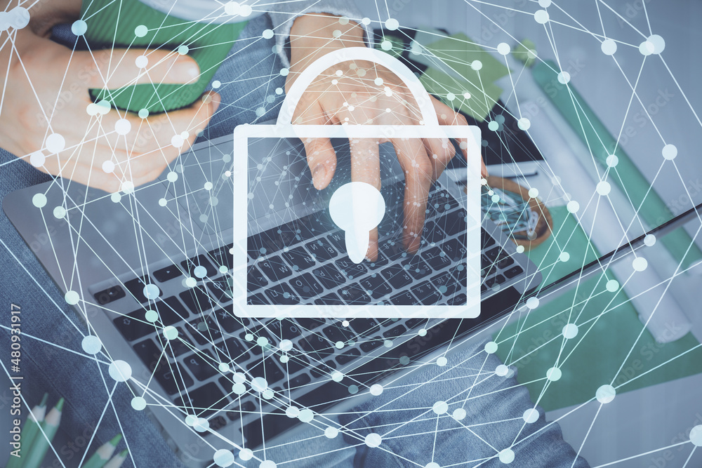 Poster double exposure of woman hands working on computer and lock hologram drawing. security concept.
