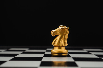 Chess piece on board game planning and competition on black background.