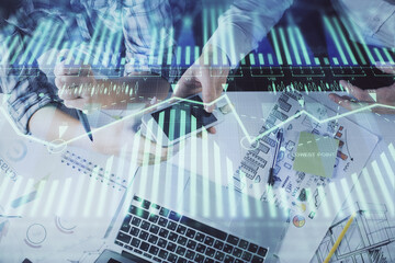 Double exposure of data theme hologram drawing and man and woman working together holding and using a mobile device.