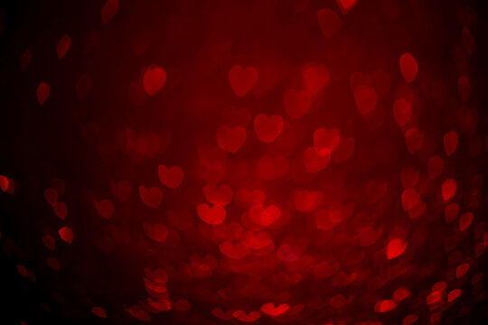 Red hearts, sparkling glitter bokeh background, valentines day abstract defocused texture