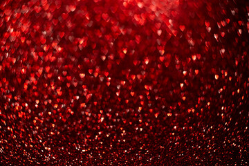 Red hearts, sparkling glitter bokeh background, valentines day abstract defocused texture