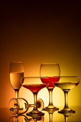 Glassware of different sizes against colorful background