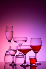 Glassware of different sizes against colorful background