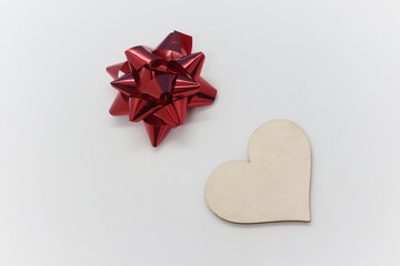 Festive wooden heart with a red bow