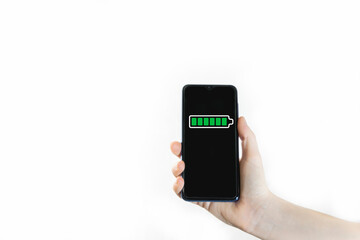 Hand holding phone with full battery on screen isolated on white background