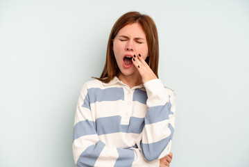 Young English woman isolated on blue background yawning showing a tired gesture covering mouth with hand.