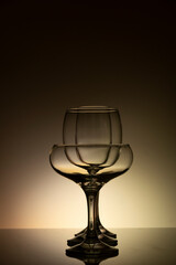 Glassware of different sizes against colorful background