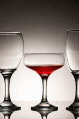 Glassware of different sizes against monochrome background