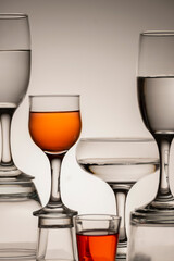 Glassware of different sizes against monochrome background