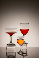 Glassware of different sizes against monochrome background