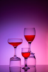 Glassware of different sizes against colorful background