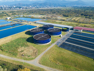 Drone view of sewage treatment plants, filtration of dirty or waste water. Stage of primary...
