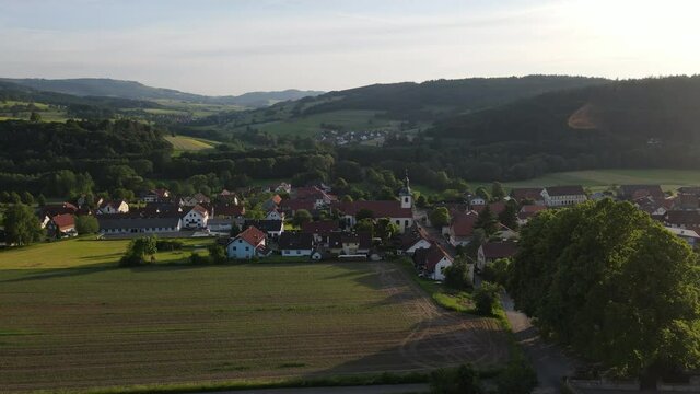 Aerial Drone of Hilders village, city in Rhön area in Germany, Rhon Mountains, 4k