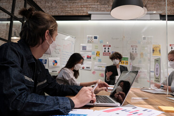 Multiracial coworker's team business brainstormed working, discussing with caucasian boss in a new...