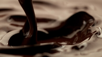 Detail of pouring melted chocolate.