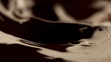 Fototapeta premium Detail of splashing melted chocolate.