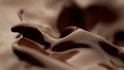 Detail of splashing melted chocolate.
