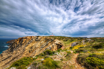 Fototapeta premium Dramatic Cliffs and Lighthouse at Cabo Espichel, Portugal