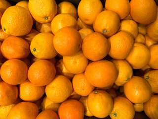 Background of sweet orange oranges or tangerines. Texture of oranges or tangerines. Oranges or tangerines close-up