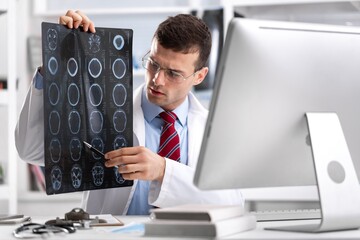 Doctor or scientist diagnosing patientâ€™s health on radiological chest x-ray film for medical...