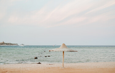 beach at sunset sun loungers and umbrellas 