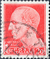 Italy - circa 1943: a postage stamp from Italy showing a portrait of the Roman Emperor Julius Caesar