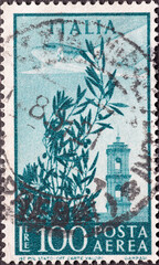 Italy - circa 1948: a postage stamp from Italy showing an Olive tree, airplane and tower of...