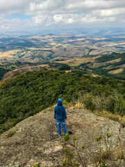 Fototapeta premium A dreamer, the nature and a big world. Hiker on top of mountain