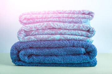 Stack of blue clean bath towels, beauty and massage spa
