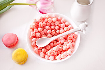 bowl with strawberry sweet corn balls. Delicious and healthy breakfast cereal.