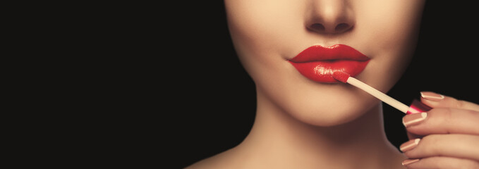 Pretty face beauty lady Red woman lips close up. Beautiful model girl with lipstick. Products Treatment. She gets gloss