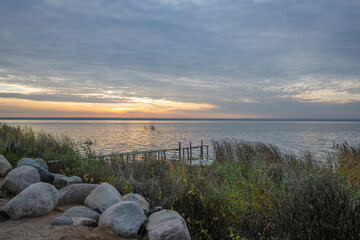 Colorful sunrise on the shores of Lake Nero. Autumn landscape with a lake in the early morning. A...