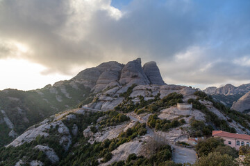 Picturesque landscape with mountains. Landscape and beautiful sunset on Montserrat mountain. Rock formations and cliffs in the Catalan Natural Park of Montserrat. Barcelona, Catalonia, Spain