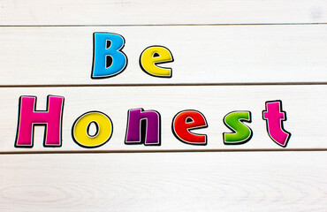 Be Honest. Positive affirmation, statement. Bold neon letters on white washed background.