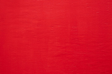 Beautiful red painted smooth wood texture, copy space. Red color design. Natural painted background...
