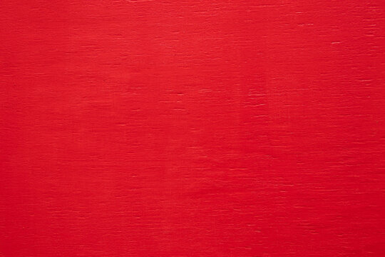 Beautiful red painted smooth wood texture, copy space. Red color design. Natural painted background for Valentine's Day