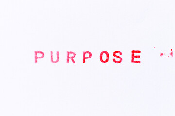 Red color ink rubber stamp in word purpose on white paper background