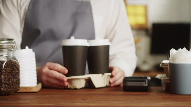 Cash payment in a restaurant. Customer pays by cash in a cafe. Buying food or drinks and giving american dollar banknote.