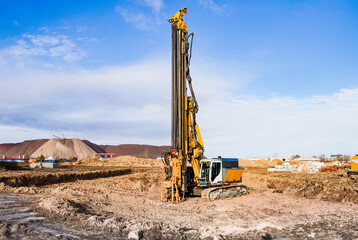 A powerful drilling rig for peeling at a construction site. Operation of the drilling rig in...