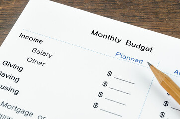 A print out of a monthly budget for your text with pencil