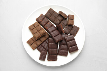 Plate with delicious and healthy hematogen on white table, top view