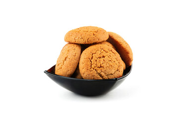 Oatmeal cookies in a plate on a white background.